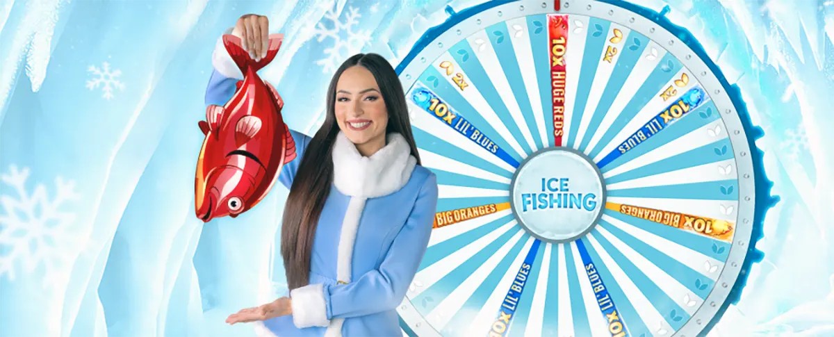 Smiling presenter in a blue winter coat holds up a red fish beside an “Ice Fishing” prize wheel, set against an icy, snowflake-themed background.