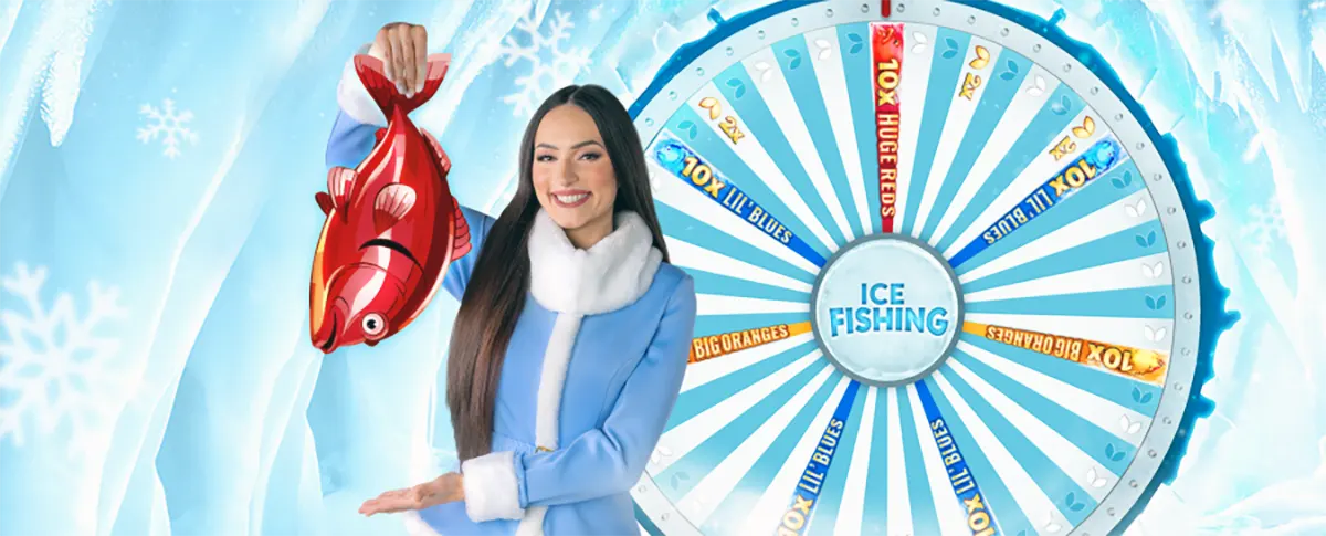 Smiling presenter in a blue winter coat holds up a red fish beside an “Ice Fishing” prize wheel, set against an icy, snowflake-themed background.